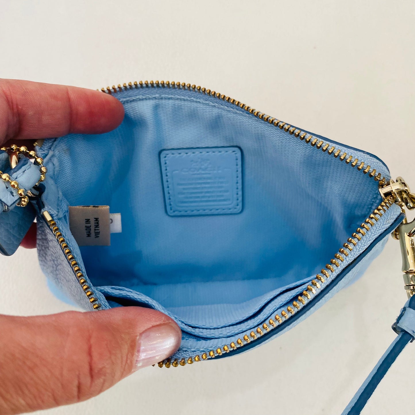 COACH Embossed Wristlet Light Blue