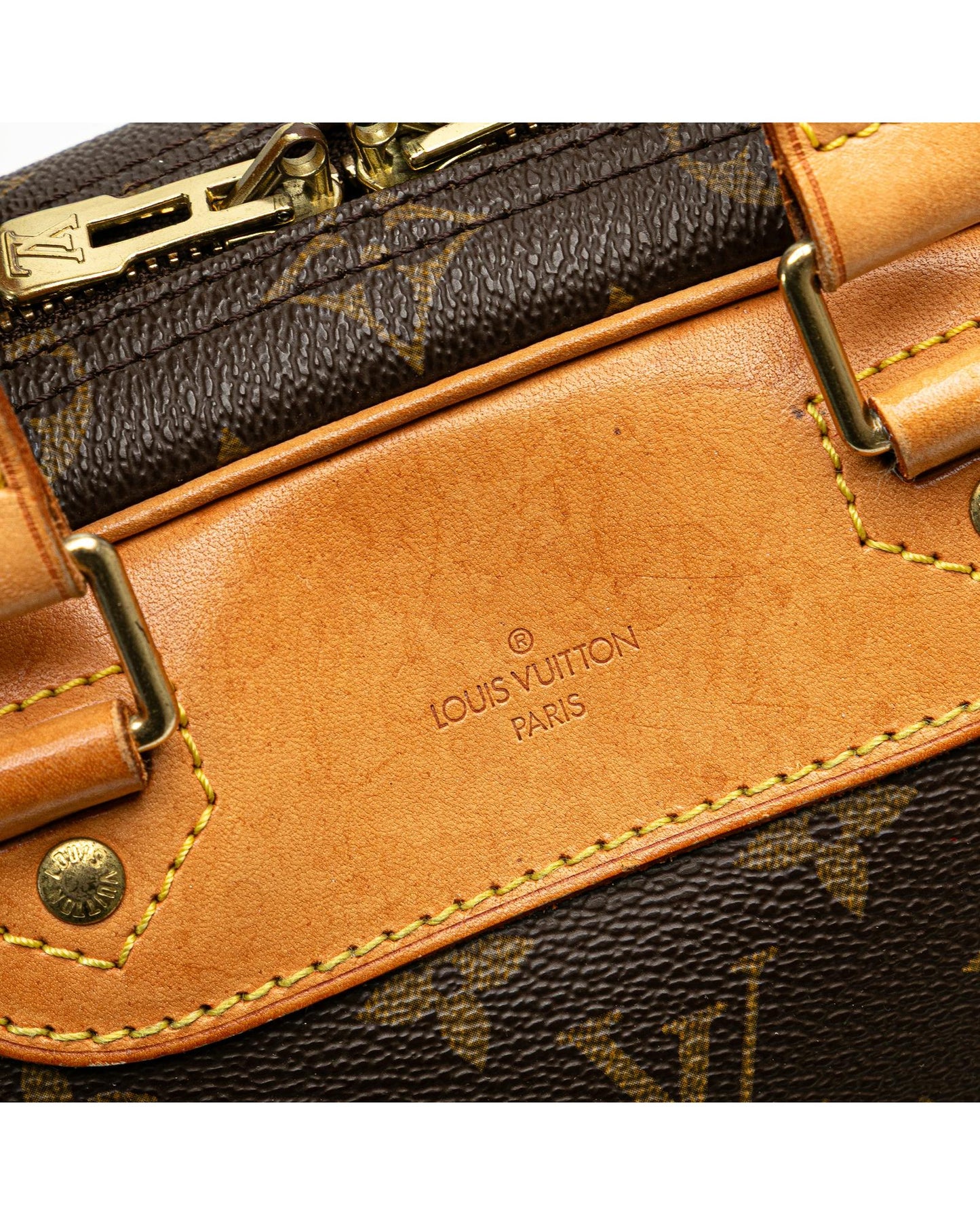 Monogram Canvas Excursion Bag with Vachetta Leather Trim and Zip Closure