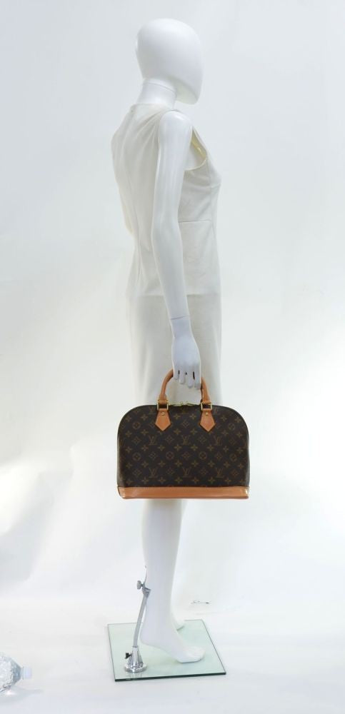 Louis Vuitto Alma Monogram Canvas Handbag