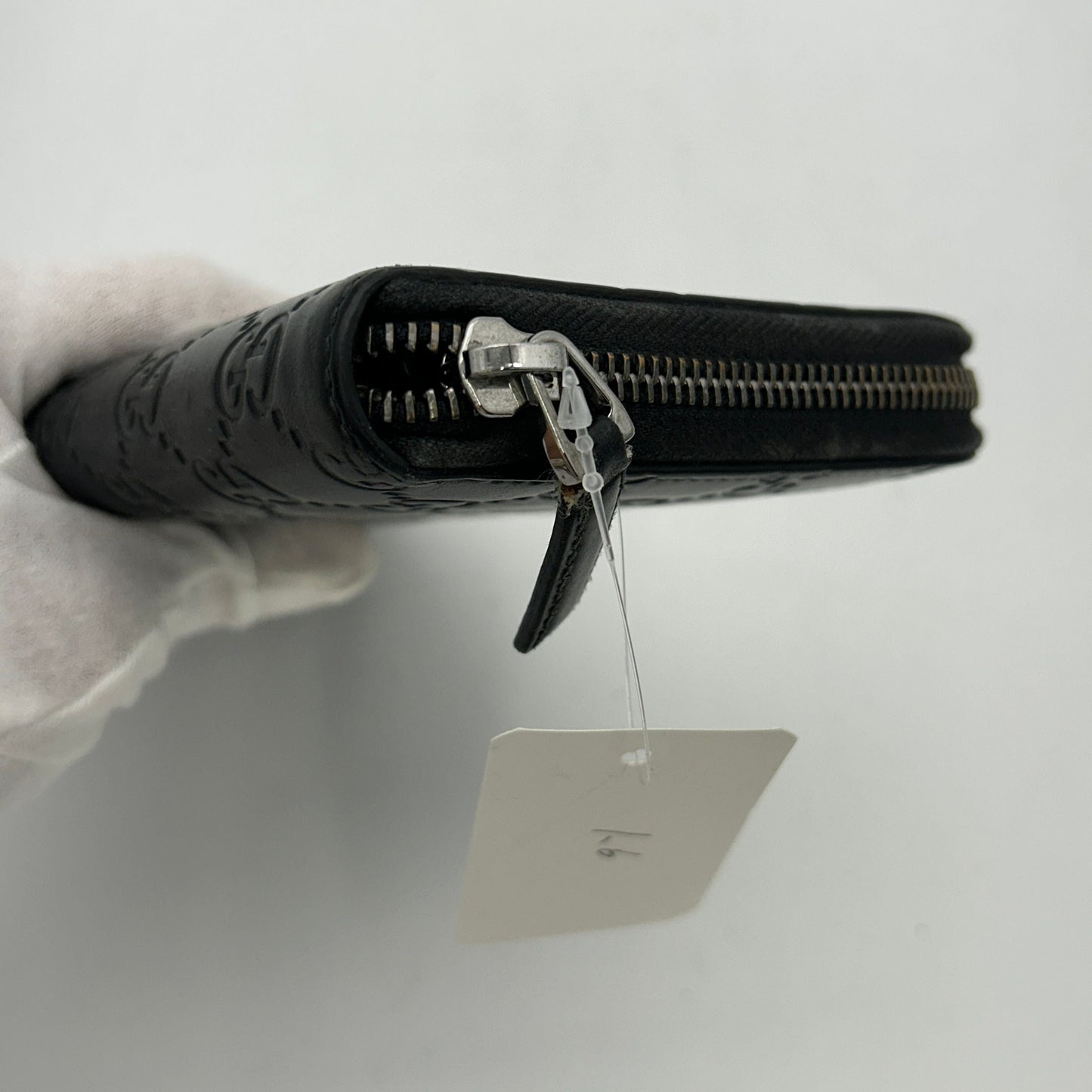 Gucci GG rubber-effect zip around wallet in black leather gu6612gd