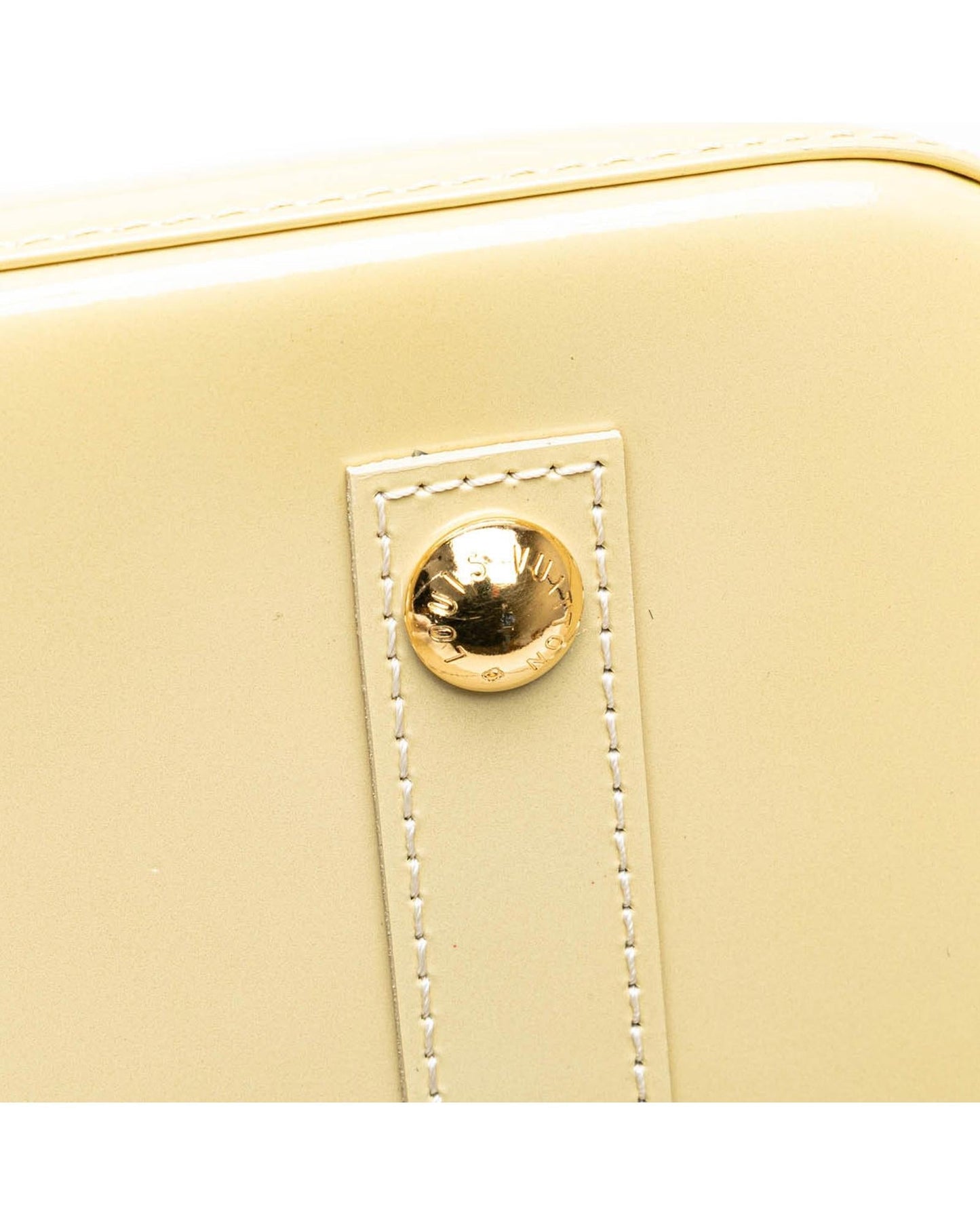 Monogram Vernis Alma PM Handbag with Rolled Handles and Interior Slip Pockets
