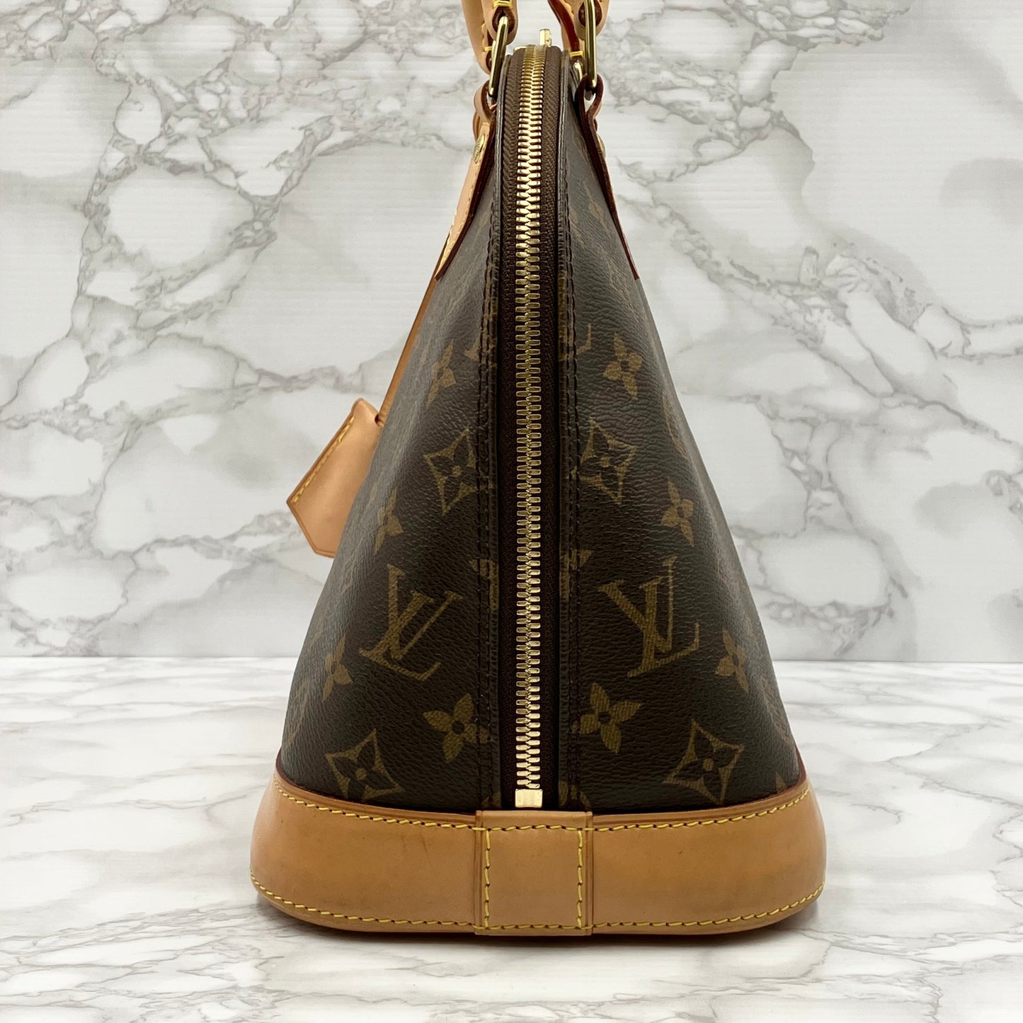 LOUIS VUITTON Monogram Alma PM Handbag