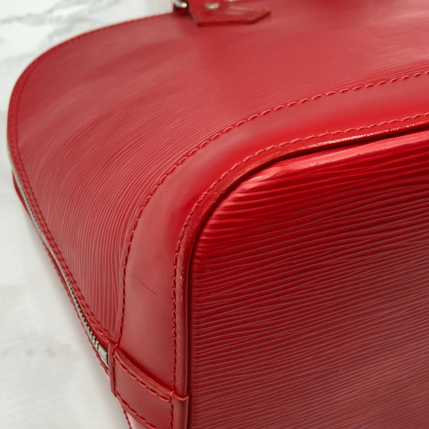 LOUIS VUITTON Epi Alma PM Handbag