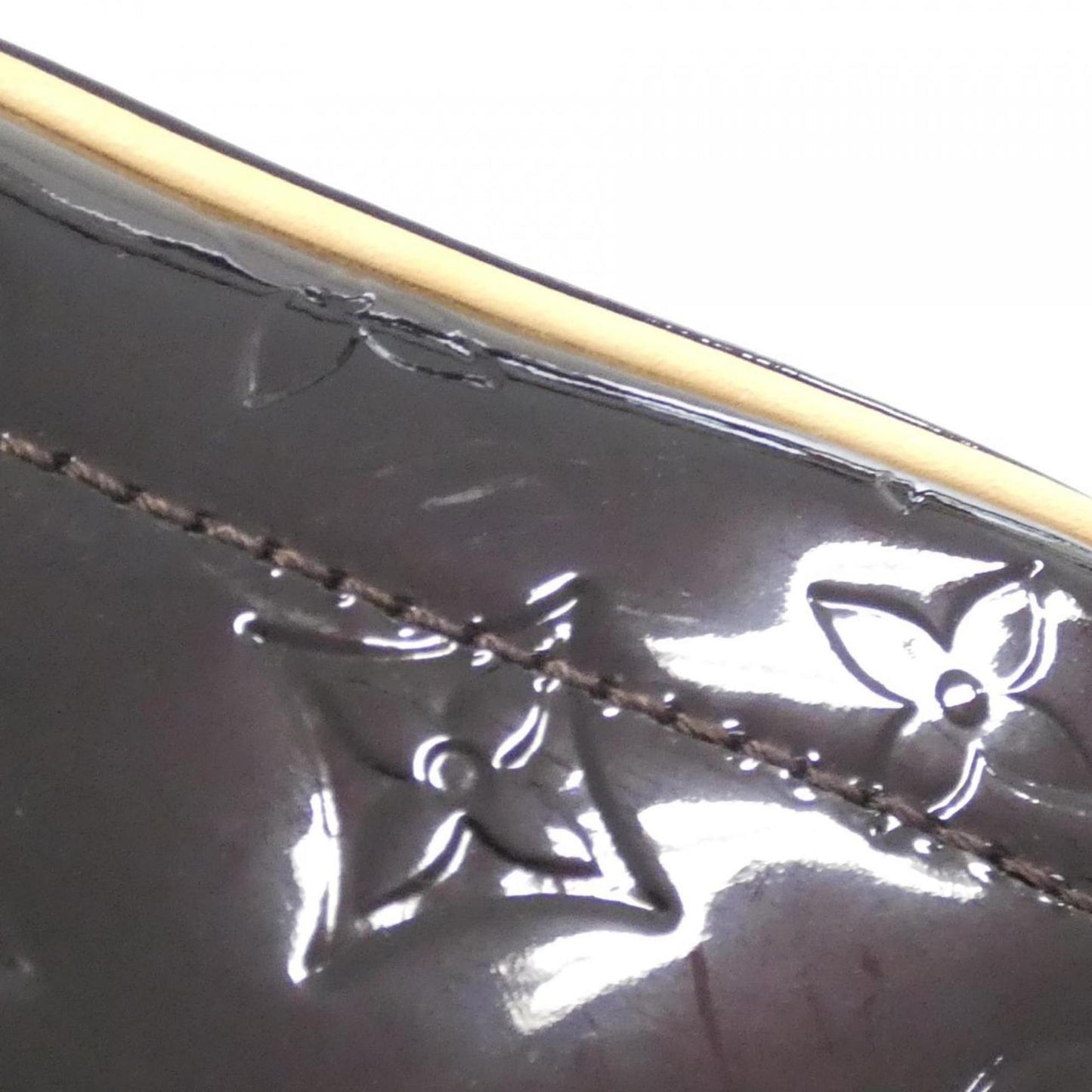 Monogram Vernis Alma MM Patent Leather Handbag