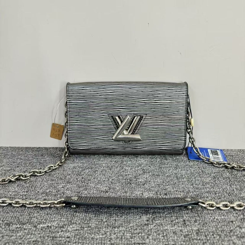 Louis Vuitton Twist WOC Silver Clutch